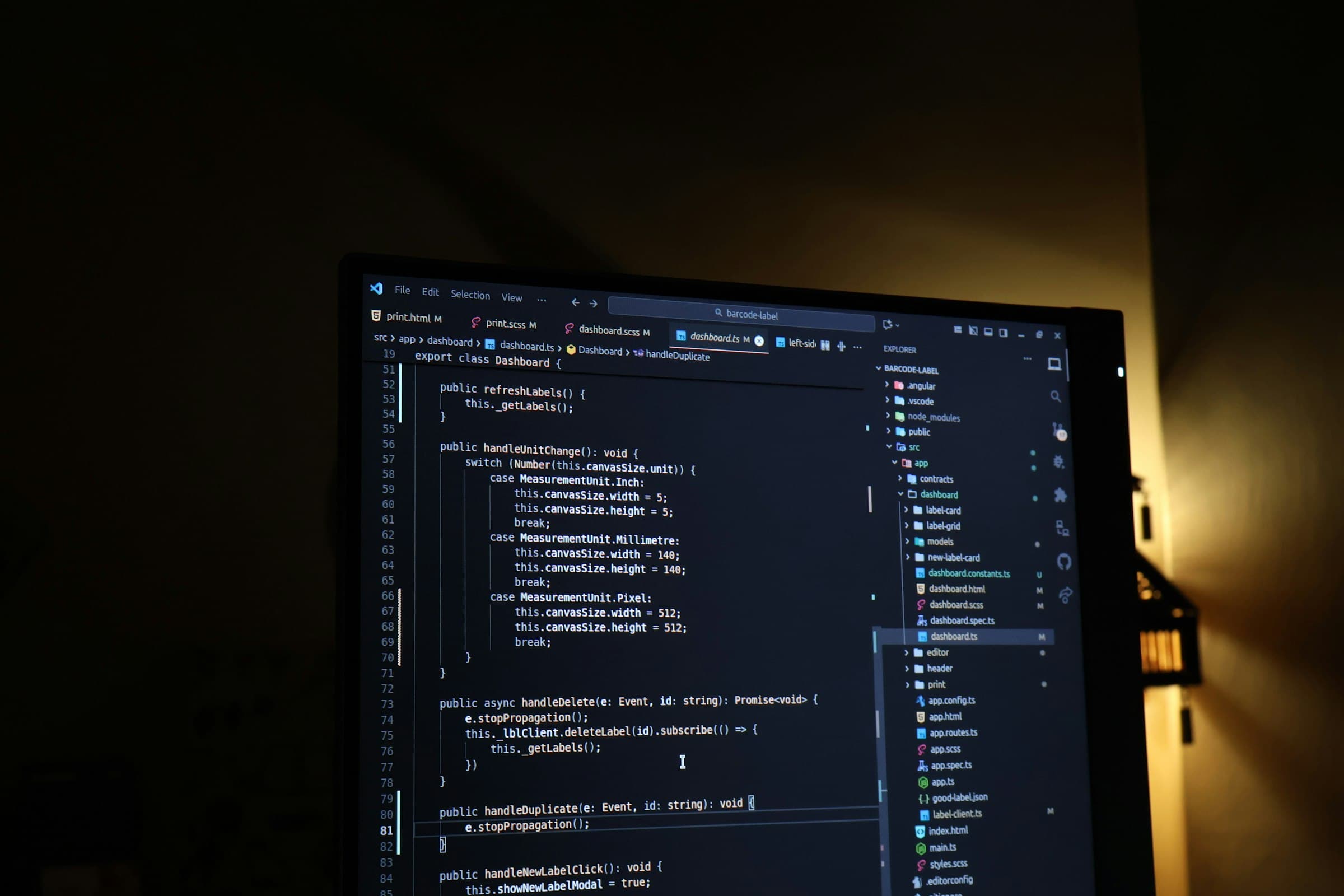 A code editor lit by a warm desk lamp at night
